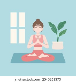 Mädchen praktiziert Yoga Meditation in namaste Pose sitzen auf der Yoga-Matte neben dem Fenster drinnen