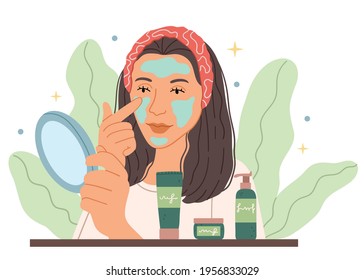 The girl puts a mask in front of a mirror.Organic skin care, lifestyle. Beauty spa and cosmetology.Put moisturizing lifting nourishing day creme on soft hydrated moisturized skin in bathroom.