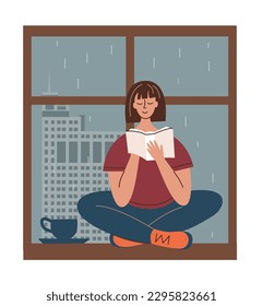 Girl is reading a bbook sitting on the windowsill. It's raining outside window. Home pastime concept.