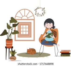 The girl is reading a book. home interior, comfort. Home plants. Learning at home