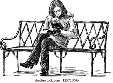girl reading the book on a bench