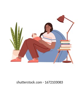 Girl reading a book and resting concept. Feminine Daily life and everyday routine scene by young woman at home