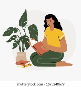 Girl reading a book and resting concept. Woman self isolation in her home 