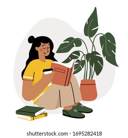 Girl reading a book and resting concept. Woman self isolation in her home 