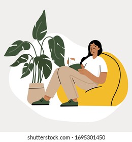 Girl reading a book and resting concept. Woman self isolation in her home 