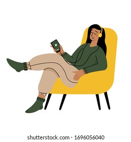 Girl reading a book and resting concept. Woman self isolation in her home 