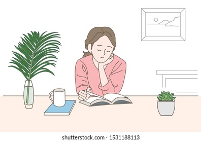 A girl is reading a book sitting at a table. hand drawn style vector design illustrations. 