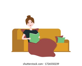Girl reading a book under a blanket without gadgets self-isolated at home