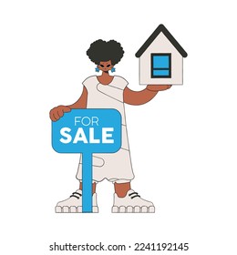 Girl realtor holds a house in her hands. Home ownership.