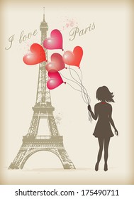 Girl with red balloons in Paris near the Eiffel Tower