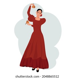 A girl in a red dress dances with castanets. Flamenco. Spanish dance with castanets - flamenco
