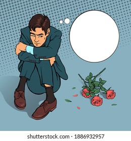 The girl refused to love the young man. Sad man sits on the floor with thrown roses. Vector comic pop art illustration.