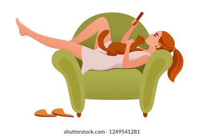 girl resting in a chair with a cat and a phone.