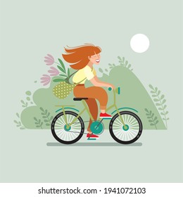 A girl rides a bicycle through a field.