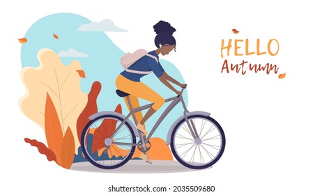 Girl rides a bike, African-American woman rides a bike in the autumn landscape. Poster or banner for bike shop, sportswear or postcard