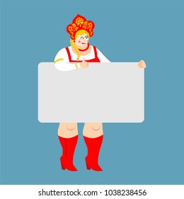 Girl in Russia national costume holding banner blank. Russian Patriotic clothes and white blank. Female thumb up and winks joyful emotion. place for text. Historical folk Dress. Kokoshnik
