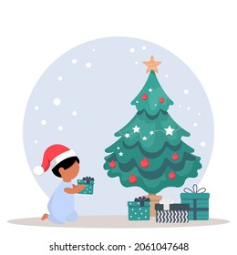 A girl in a Santa hat sits under a Christmas tree and holds a box with a gift. Cute Christmas vector illustration in cartoon style