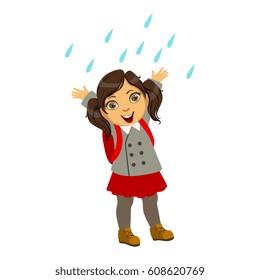 Girl In School Uniform, Kid In Autumn Clothes In Fall Season Enjoyingn Rain And Rainy Weather, Splashes And Puddles