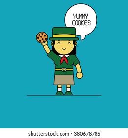 Girl scout holding cookies in hand.