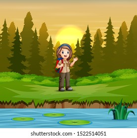 Girl scout in uniform hiking on the forest