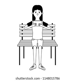 Girl seated on chair using portable videogame in black and white