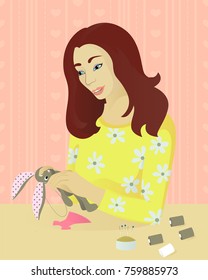 Girl sews a toy