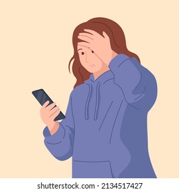 The girl is shocked by the message or news. A young girl in a hoodie with a phone in her hands.