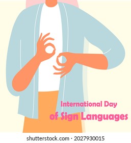 The girl shows a gesture with her hands. Inscription International Day of Sign Languages. Vector flat illustration