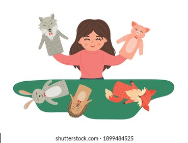Girl shows puppet theatre show.  Kids' creativity and imagination development playing.