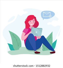 girl sit with a tablet on the ground in a park