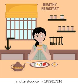 girl sits in the kitchen at the table, in front of her plate with a useful breakfast and in her hands a cup