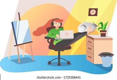 The girl sits on a computer chair and put her legs on the bedside table, she works at home with a laptop, the cat sleeps on the girl’s legs, the artist’s bright room with an easel