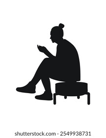 Girl sits with a phone on a banquette, silhouette of a female figure