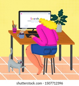 A girl sits at a table in front of a computer.