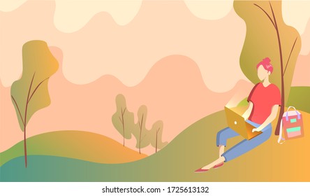 A girl sits under a tree in a park and works on a laptop. Background landscape of hill trees and orange sky