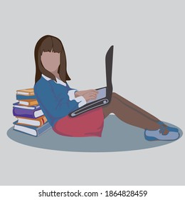 the girl is sitting with books and working on a laptop