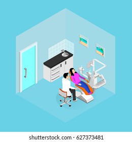 The girl is sitting in a chair for examination and treatment by a dentist in a light dental office