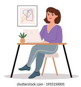 Girl sitting at a laptop in a cozy and modern home office. Favorite work from home.The daily life of the freelance worker, everyday routine.