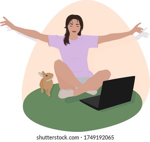 a girl is sitting in nature and working with a laptop, while a pet is sitting nearby
works remotely