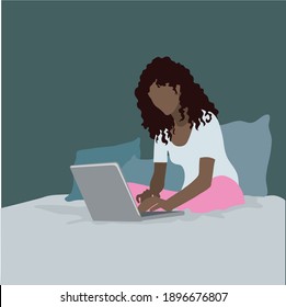 Girl sitting on the bed and working with laptop in social network