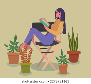 Girl sitting on a chair reading a book in a room with plants