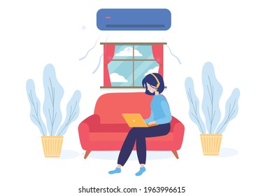 Girl sitting on a couch and using laptop