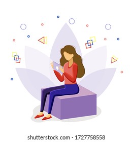 the girl is sitting on a cube with a tablet.