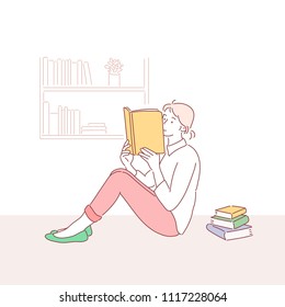 Girl is sitting on the floor and is reading a book. hand drawn style vector doodle design illustrations.