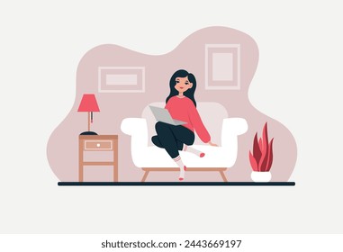 Girl sitting on the sofa with a laptop.