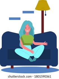 The girl is sitting and resting on the blue sofa at home