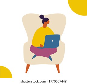 Girl sitting in soft chair with a laptop. Cozy home.  Relaxing at home, leisure time	