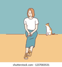 A girl is sitting thoughtfully, and a cat is looking at her by her side. hand drawn style vector design illustrations.