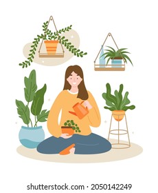 Girl sitting and watering plant. Houseplant care in urban home garden. Caring for potted plants. Ecology hobby.