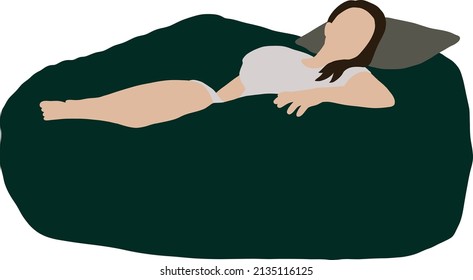 Girl sleeping on a green bean bag chair